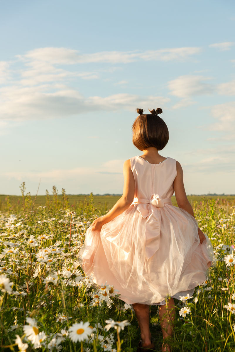 Children's dress with bow and pearls